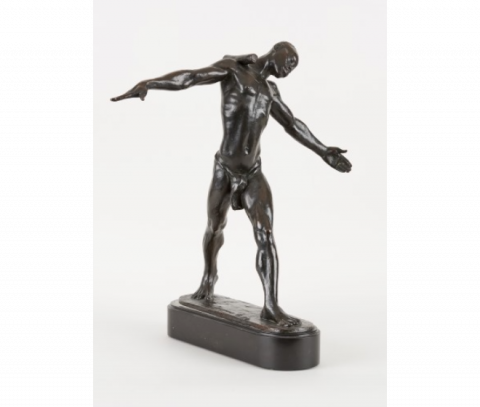 Sculpture en bronze à patine foncée "Le porteur d'ivoire"